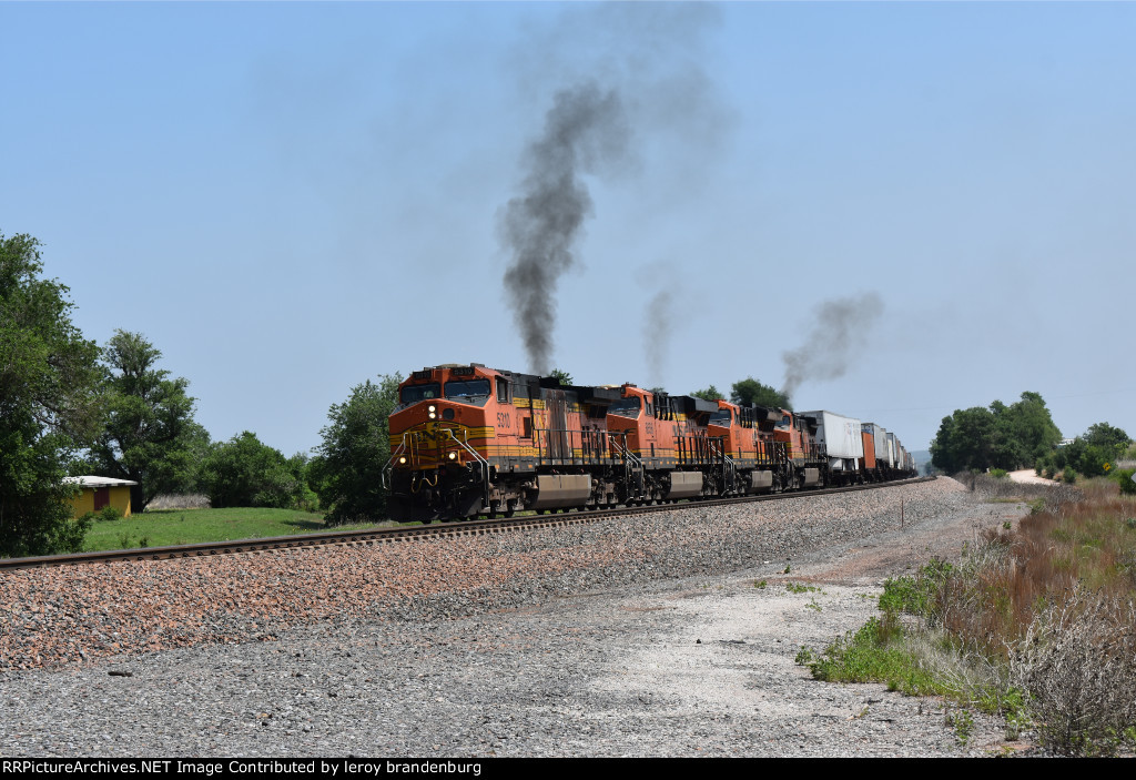 BNSF 5310 starts out after stopping to let a slower train ahead go
